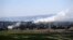Smoke rises from the Israeli occupied Golan Heights near the Kuneitra border crossing, close to the ceasefire line between Israel and Syria, June 6, 2013.