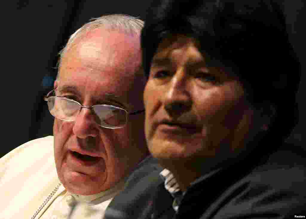 Pope Francis speaks to Bolivian President Evo Morales (right) during a World Meeting of Popular Movements in Santa Cruz, July 9, 2015.
