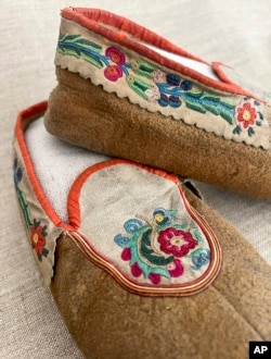 This undated photo provided on Wednesday, July 20, 2022, by Gregory Scofield, shows a pair of shoes he made in the late 19th-century Cree-Metif native Canadian traditional style. The Vatican's Anima Mundi Ethnological Museum houses tens of thousands of artifacts and art made by Indigenous peoples from around the world. (Gregory Scofield via AP)
