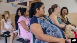 FILE - Women wait for prenatal exams at the National Hospital for Women in San Salvador, El Salvador, Jan. 29, 2016. Many fear infection by the Zika virus, which may be linked to neurological disorders in babies.