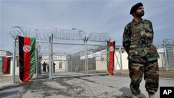An Afghan National Army soldier stands in front of the gate of the newly refurbished Pul-e-Charkhy prison during an opening ceremony in Kabul, Afghanistan, March 2007 (file photo)