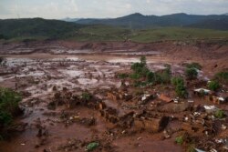 Aerial view of the debris after a dam burst at the small town of Bento Rodrigues in Minas Gerais state, Brazil, Nov. 6, 2015.