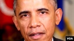 Shugaba Barack Obama na Amurka wanda tuni ya rabbataba hannu akan dokar.