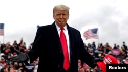 U.S. President Donald Trump arrives for a campaign rally at Oakland County International Airport in Waterford Township, Michigan, Oct. 30, 2020. 