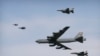 FILE - A U.S. Air Force B-52 bomber flies over Osan Air Base in Pyeongtaek, South Korea, Jan. 10, 2016. The bomber flew low over South Korea on Sunday, a show of force from the US as a Cold War-style standoff deepened between ally Seoul and North Korea.