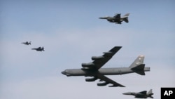 FILE - A U.S. Air Force B-52 bomber flies over Osan Air Base in Pyeongtaek, South Korea, Jan. 10, 2016. The bomber flew low over South Korea on Sunday, a show of force from the US as a Cold War-style standoff deepened between ally Seoul and North Korea.