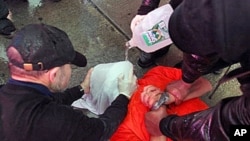 Demonstrators from the group 'World Can't Wait' hold a mock waterboarding of a prisoner (file photo)