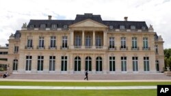 FILE - The Organization for Economic Cooperation and Development headquarters is pictured in Paris, June 7, 2017. Nearly 140 countries have agreed on a tentative deal to change how big, multinational companies are taxed.