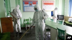Offices at the Phyongchon District People's Hospital are disinfected to help curb the spread of the coronavirus, April 1, 2020, in Pyongyang, North Korea.