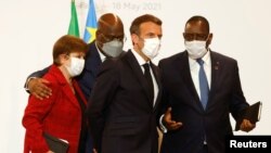 French President Emmanuel Macron, IMF Managing Director Kristalina Georgieva, Senegal's President Macky Sall and President of Congo Democratic Republic Felix Tshisekedi talk at the Summit on the Financing of African Economies in Paris, May 18, 2021.