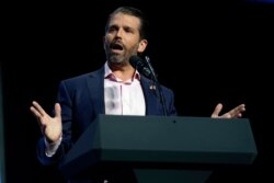FILE - Donald Trump Jr. speaks before President Donald Trump arrives, at Dream City Church in Phoenix, June 23, 2020.