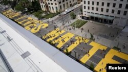 "Black Lives Matter" is painted on 16th Street near the White House as protests against the death in Minneapolis police custody of George Floyd continue in Washington, June 5, 2020. 