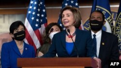 US Speaker of the House Nancy Pelosi speaks during a new conference with House Democrats and the Congressional Asian Pacific American Caucus on the "Covid-19 Hate Crimes Act" on Capitol Hill in Washington, May 18, 2021. 