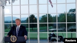 U.S. President Donald Trump speaks at a dinner with business leaders at Trump National Golf Club in Bedminster, New Jersey, Aug. 7, 2018.
