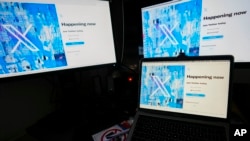 FILE - Computer monitors and a laptop display the X, formerly known as Twitter, sign-in page, July 24, 2023, in Belgrade, Serbia. 