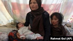 Fatima is a displaced Afghan woman in Afghanistan who fled her home due to fighting between the Taliban and Afghan security personnel on Thursday, July 8, 2021. (AP Photo/Rahmat Gul)