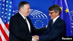 U.S. Secretary of State Mike Pompeo shakes hands with European Parliament President David Sassoli at the EU Parliament in Brussels, Belgium, Sept. 3, 2019.
