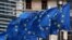 European Union flags fly outside the European Commission headquarters in Brussels, Belgium, March 6, 2019.