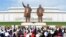 FILE - People visit the the statues of North Korea's founder Kim Il Sung and late leader Kim Jong Il on the 74th anniversary of North Korea's founding, in Pyongyang, North Korea in this photo released by North Korea's Korean Central News Agency (KCNA) Sept. 10, 2022. 