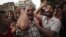 Egyptian protesters chant slogans against the country's ruling military council and presidential candidate Ahmed Shafiq in Tahrir Square in Cairo, Egypt, Thursday, June 14, 2012.