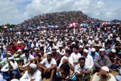 FILE - Rohingya refugees gather to mark the second anniversary of the exodus at the Kutupalong camp in Cox’s Bazar, Bangladesh, Aug. 25, 2019.
