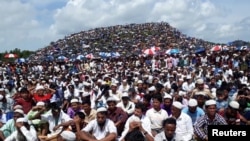Rohingya refugees gather to mark the second anniversary of the exodus at the Kpalong camp in Cox’s Bazar, Bangladesh, Aug. 25, 2019.