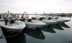 Screengrab from video showing Iranian speed boats during a March 2016 ceremony.