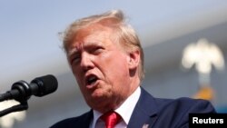 FILE - Former U.S. President and Republican presidential candidate Donald Trump speaks during a 2024 presidential election campaign event at Sportsman Boats in Summerville, South Carolina, Sept. 25, 2023.