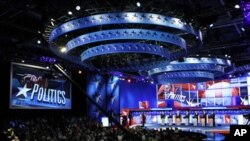 Republican presidential hopefuls at the beginning of the first New Hampshire debate of the 2012 campaign in Manchester, New Hampshire June 13, 2011