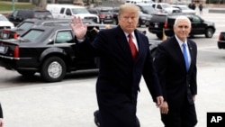  President Donald Trump arrives with Vice President Mike Pence to attend a Senate Republican policy lunch on Capitol Hill in Washington.