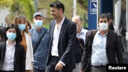 Al Jazeera staff leave Bukit Aman police headquarters after being questioned by the Malaysian police over a documentary about the country’s arrests of undocumented migrants, in Kuala Lumpur, Malaysia July 10, 2020. 