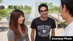 Weber State University students talk near a fountain on the campus in Ogden, Utah.