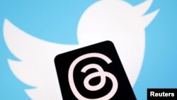 Illustration shows Meta's Threads app and Twitter logos