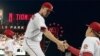 Washington Nationals starting pitcher Stephen Strasburg is met by pitching coach Steve McCatty as he walks off the field in the seventh inning after 14 strikeouts in his major league debut, during the baseball game against the Pittsburgh Pirates in Washin