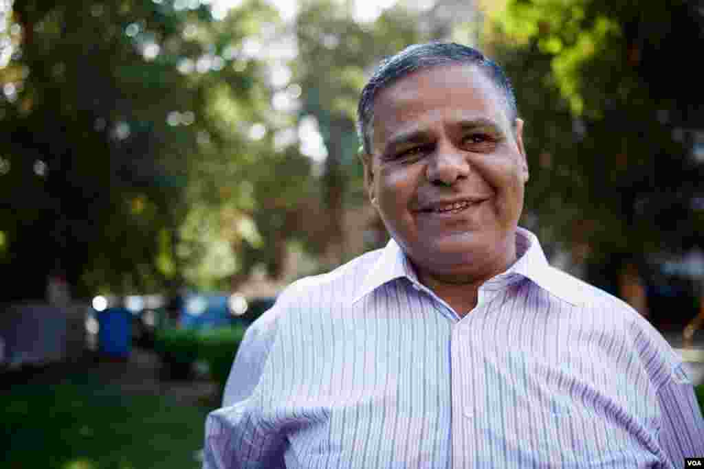 Former Christian Ayman Ramzi is the lone atheist in his family. His wife and daughter are practicing Christians. He jokes, &quot;They have their church and I have my Facebook.&quot; Oct. 25, 2013, Cairo. (Yuli Weeks for VOA)