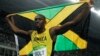 Usain Bolt from Jamaica celebrates after crossing the line to win the gold medal in the men's 200-meter final during the athletics competitions of the 2016 Summer Olympics at the Olympic stadium in Rio de Janeiro, Brazil.