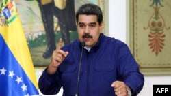 Handout picture released by the Venezuelan presidency showing Venezuelan President Nicolas Maduro speaking during a press conference at the Miraflores Presidential Palace in Caracas, Venezuela, March 11, 2019.