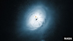 NASA/ESA Hubble Space Telescope view of the dust disc around the young star HD 100546. (ESO/NASA/ESA/Ardila et al.)