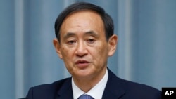 FILE - Japan's Chief Cabinet Secretary Yoshihide Suga.