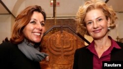 Vatican Museums Director Barbara Jatta, left, and Head of Rome's Jewish Museum Alessandra Di Castro shown during a news conference where they presented an exhibition on the menorah, the ancient symbol of Judaism, at the Jewish Museum in Rome, Feb. 20, 2017.
