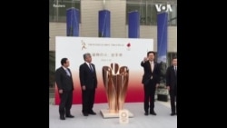 无惧病毒威胁和政府警告 日本民众围观奥运圣火