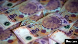FILE - Argentine 100 peso bills are displayed in this picture illustration taken Sept. 3, 2019. 