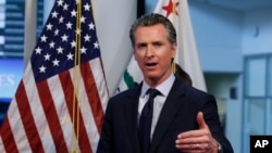 FILE - California Gov. Gavin Newsom speaks during a news conference in Rancho Cordova, Calif., April 14, 2020. 