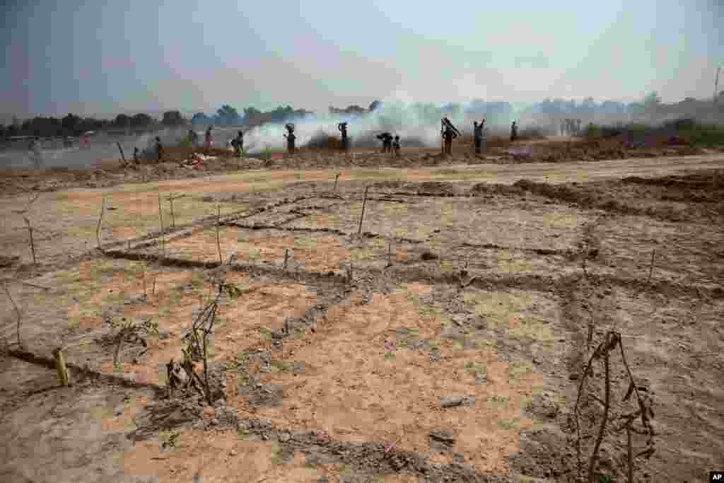 Newly-cleared plots of land are marked for settlement inside a makeshift camp at Mpoko Airport in Bangui, Jan. 7, 2014.