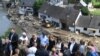 German Chancellor Angela Merkel and Rhineland-Palatinate State Premier Malu Dreyer are seen on a bridge during their visit in the flood-ravaged areas in Schuld near Bad Neuenahr-Ahrweiler, Rhineland-Palatinate state, western Germany, July 18, 2021.