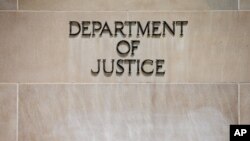 FILE - Robert F. Kennedy Department of Justice Building in Washington. 