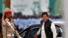 FILE - Pakistani Prime Minister Imran Khan arrives to attend a military parade in Islamabad, Pakistan, March 23, 2019.