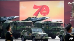 Chinese military vehicles carrying weapons including a nuclear-armed missile during a parade to commemorate the 70th anniversary of the founding of Communist China in Beijing, Tuesday, Oct. 1, 2019. (Associated Press)