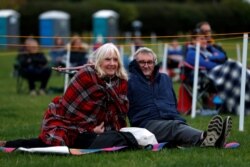 Spectators keep social distance as they attend the outdoors performance of theatre play 'Voices of The West End', at Bywell Hall, Northumberland, as the north-east of England is under lockdown, Sept. 19, 2020.
