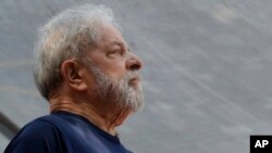 FILE - Former Brazilian President Luiz Inacio Lula da Silva looks on before speaking to supporters outside the Metal Workers Union headquarters in Sao Bernardo do Campo, Brazil, April 7, 2018.